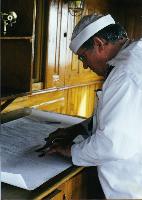 Quartermaster at work in the pilot House of the Cruiser Olympia